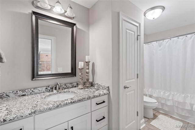 full bath with curtained shower, vanity, toilet, and tile patterned floors