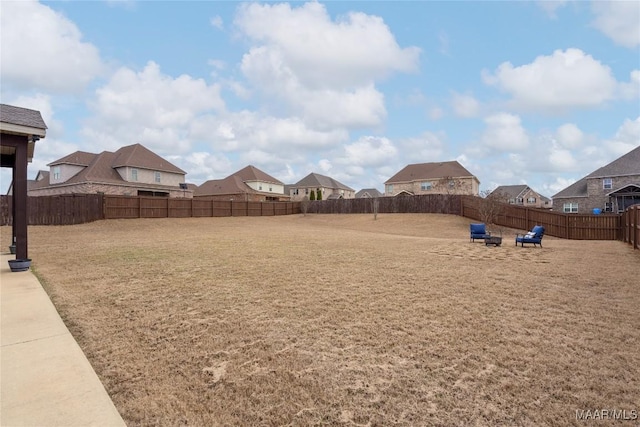 view of yard with a fenced backyard