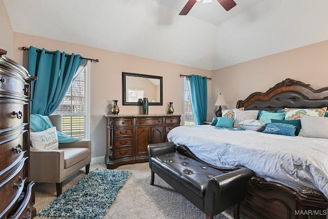 bedroom featuring vaulted ceiling, ceiling fan, carpet flooring, and baseboards