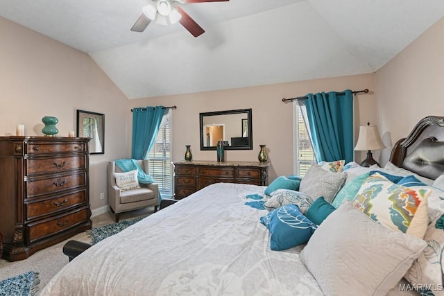 bedroom with lofted ceiling, baseboards, a ceiling fan, and carpet flooring