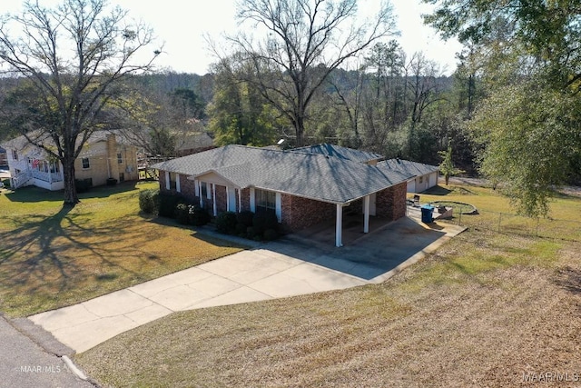 birds eye view of property featuring a view of trees