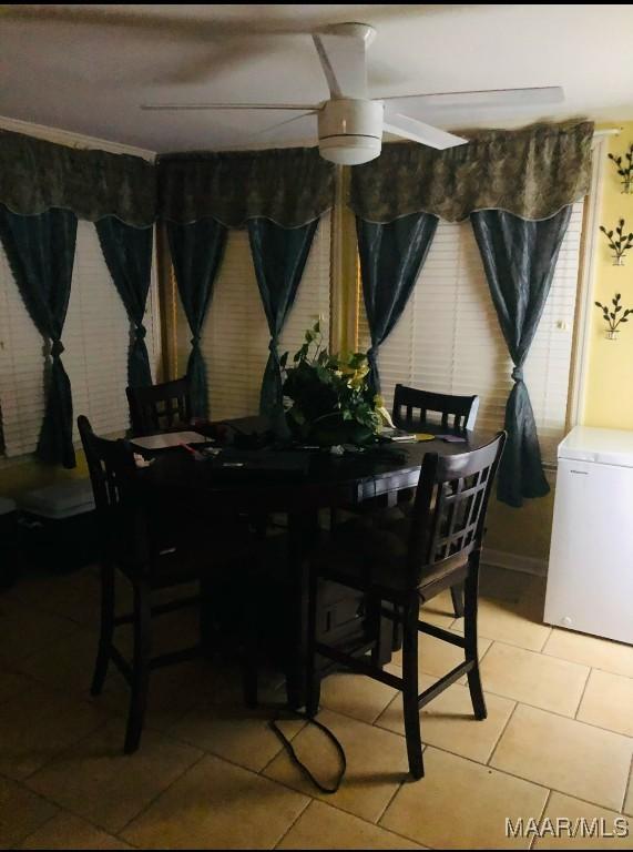 dining space with light tile patterned floors