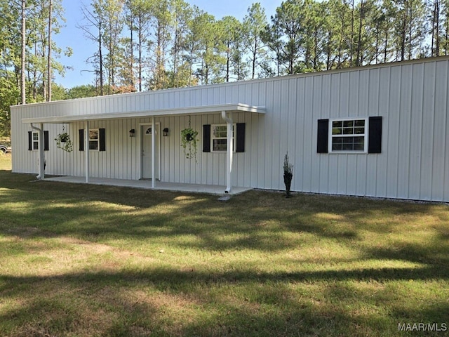 view of front of home with a porch and a front yard