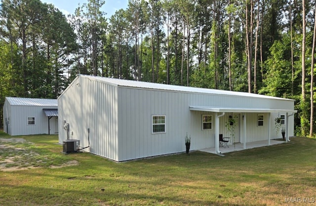 view of outdoor structure featuring central AC