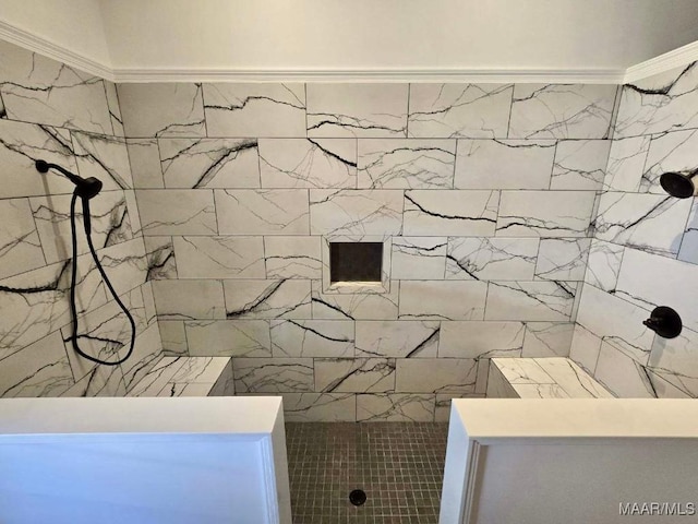 bathroom featuring a tile shower