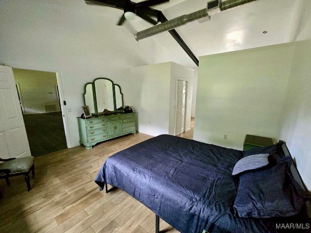 bedroom with ceiling fan, high vaulted ceiling, visible vents, light wood-type flooring, and beamed ceiling