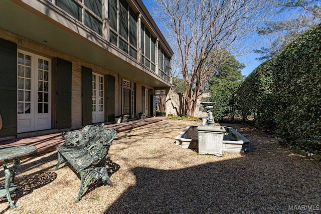 view of yard with french doors