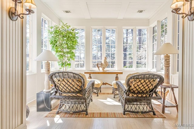 sunroom / solarium with visible vents and plenty of natural light