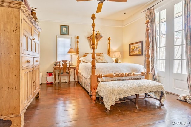 bedroom featuring ceiling fan, wood-type flooring, and crown molding