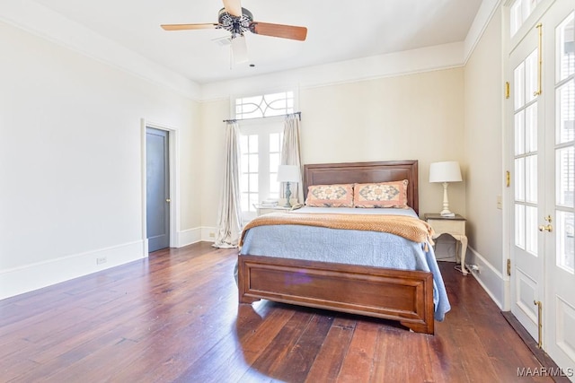 bedroom with hardwood / wood-style floors, a ceiling fan, and baseboards