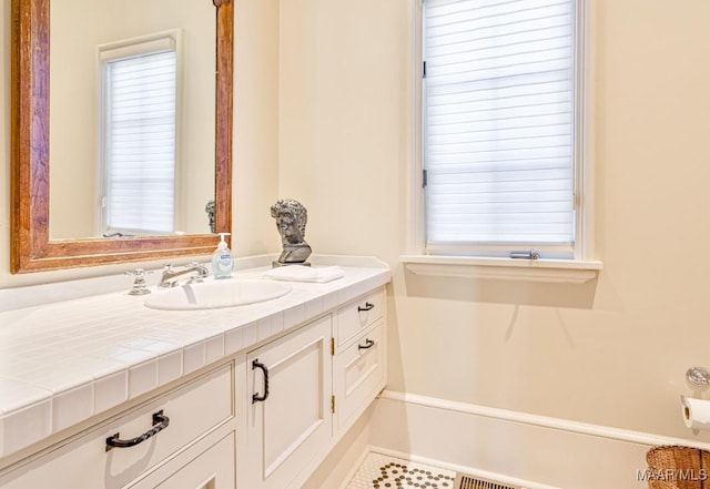 bathroom featuring vanity and a wealth of natural light