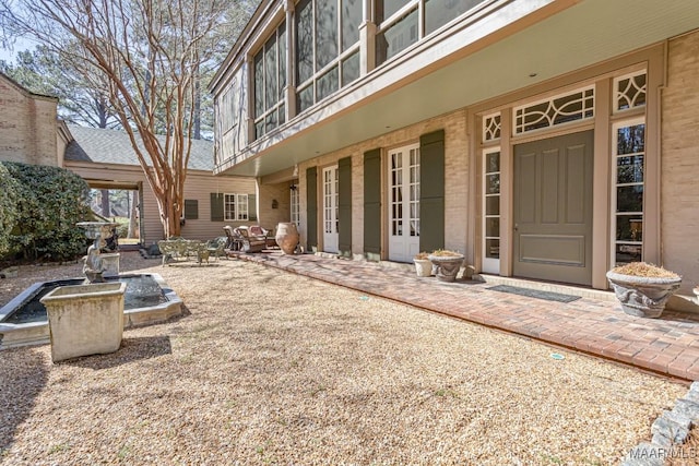 entrance to property featuring a patio area