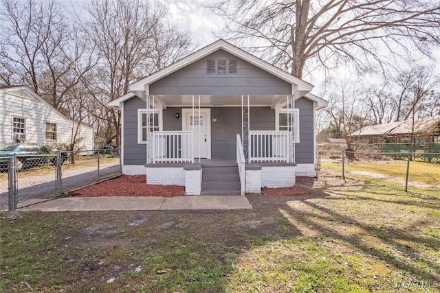 bungalow-style house featuring a gate, fence, and a porch