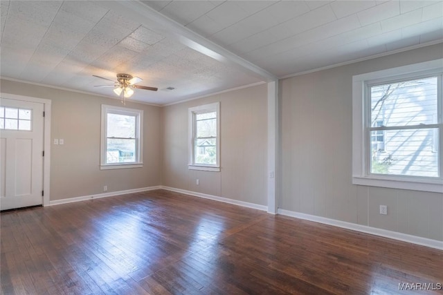 foyer featuring baseboards, ornamental molding, ceiling fan, and wood finished floors