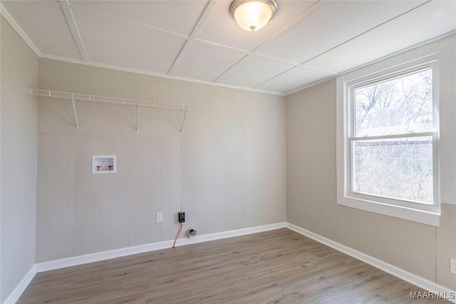 clothes washing area featuring laundry area, baseboards, washer hookup, and wood finished floors