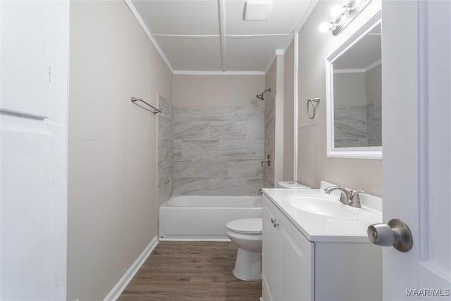 full bathroom featuring toilet, wood finished floors, visible vents, vanity, and ornamental molding