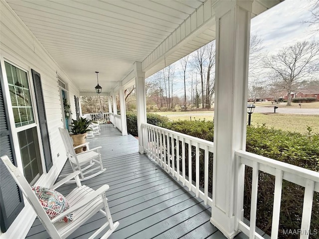 wooden terrace with a porch