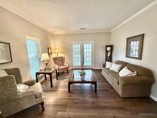 living area featuring crown molding, french doors, dark wood finished floors, and a textured ceiling