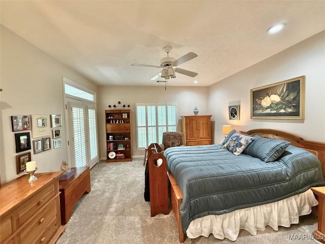 bedroom with light carpet, ceiling fan, and recessed lighting