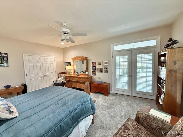 bedroom featuring ceiling fan, access to exterior, french doors, a closet, and carpet