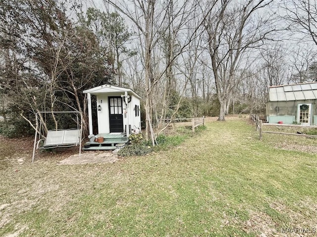 view of yard with an outbuilding and an exterior structure