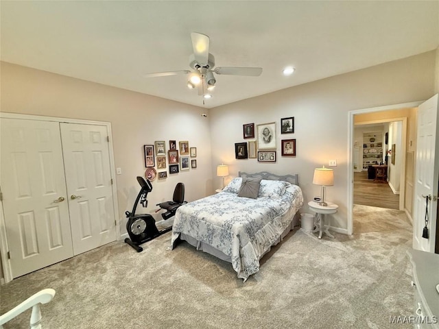 bedroom featuring light carpet, baseboards, ceiling fan, a closet, and recessed lighting