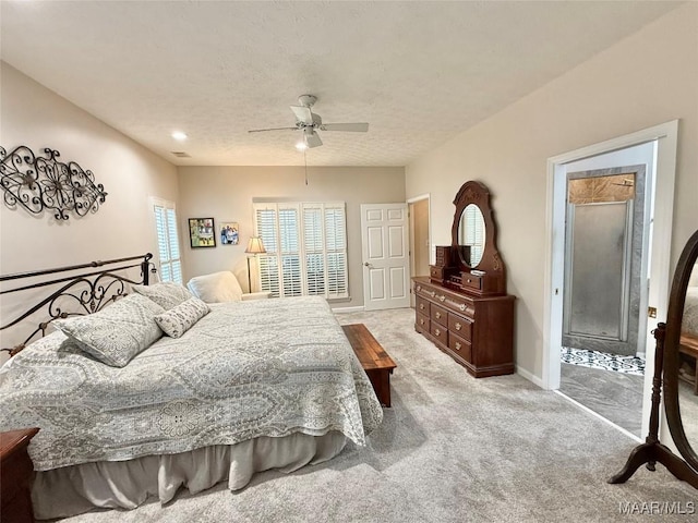 bedroom with light carpet, visible vents, baseboards, a ceiling fan, and a textured ceiling