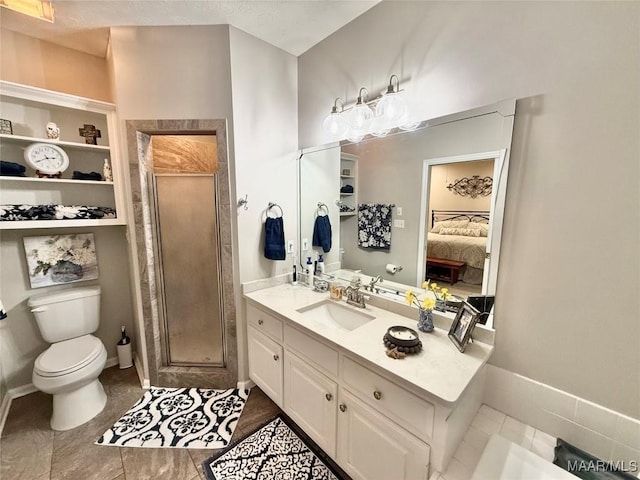 ensuite bathroom featuring a stall shower, baseboards, connected bathroom, toilet, and vanity