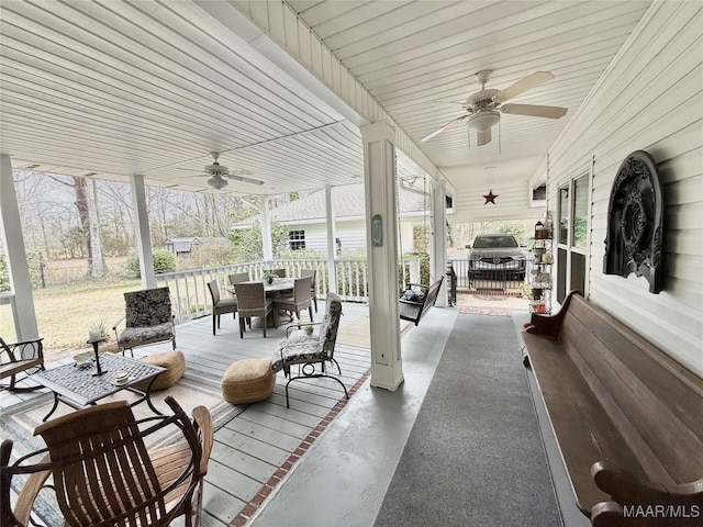 deck with ceiling fan and outdoor dining area