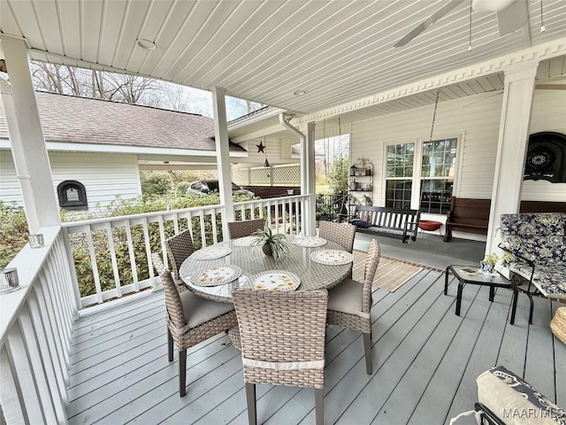 wooden deck featuring outdoor dining space