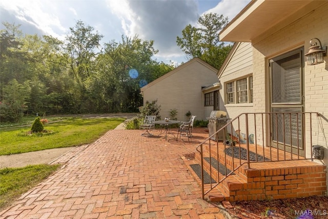 view of patio with a grill