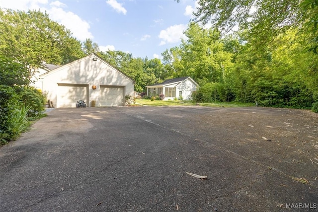 exterior space featuring a detached garage