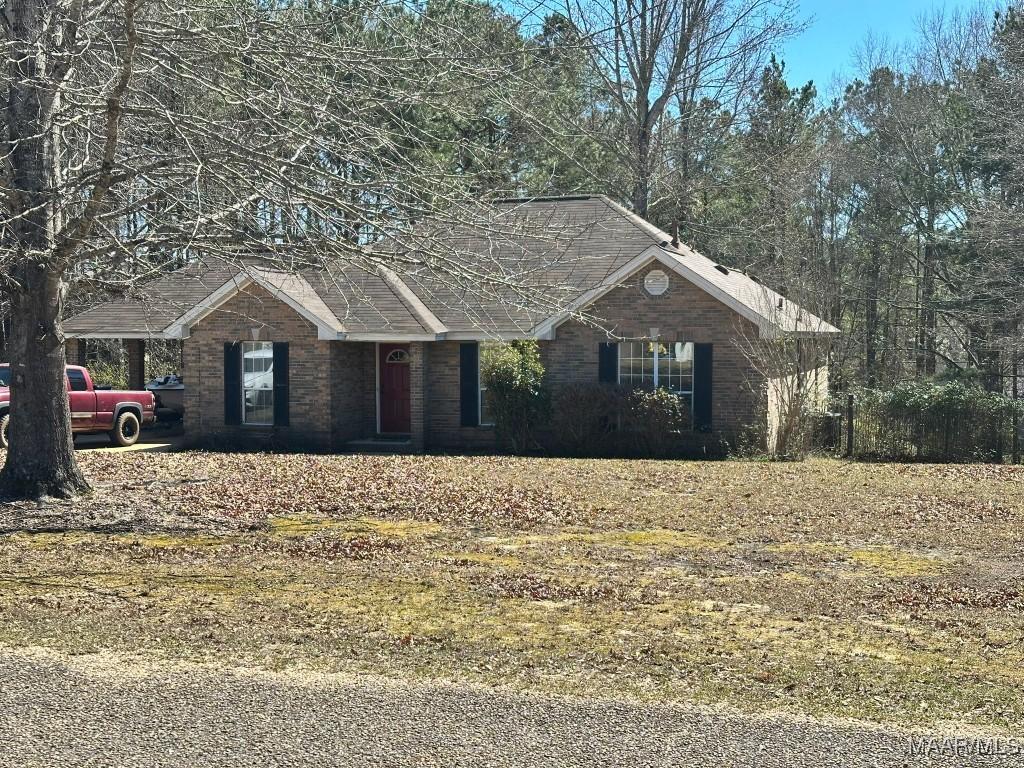 ranch-style house with brick siding