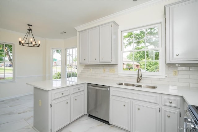 kitchen with marble finish floor, appliances with stainless steel finishes, ornamental molding, a sink, and a peninsula