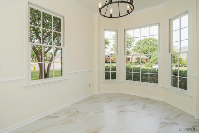 unfurnished dining area featuring marble finish floor, ornamental molding, and baseboards