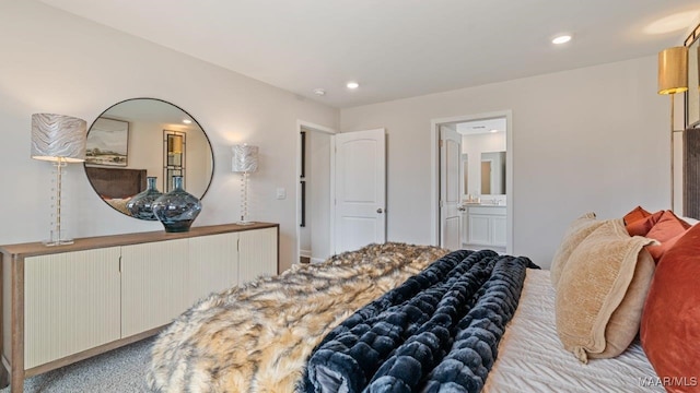 bedroom with recessed lighting and ensuite bath