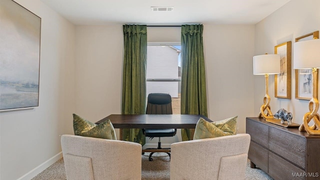 office space with baseboards, visible vents, and carpet flooring