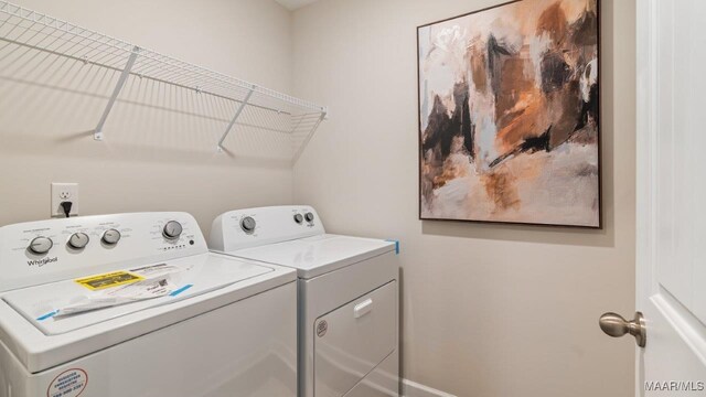 laundry area featuring washer and dryer and laundry area