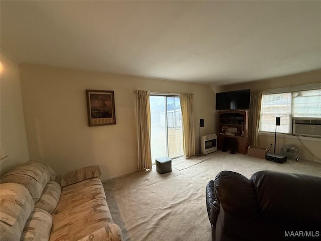 living area featuring light carpet and heating unit