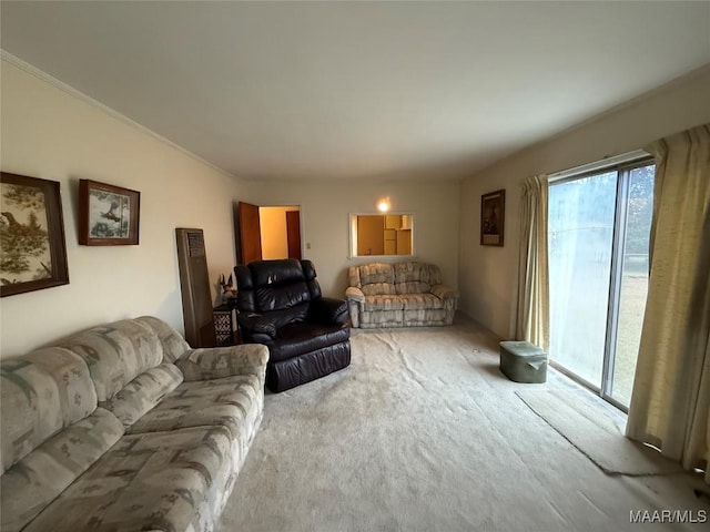 carpeted living area featuring crown molding