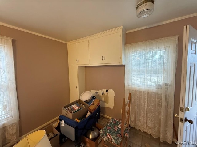 miscellaneous room with crown molding and tile patterned floors