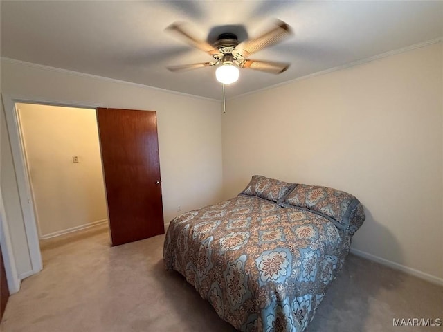 bedroom featuring a ceiling fan, light colored carpet, crown molding, and baseboards