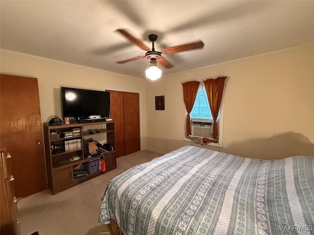 carpeted bedroom featuring ceiling fan and cooling unit