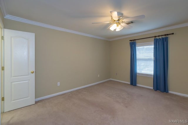 carpeted empty room featuring visible vents, ornamental molding, a ceiling fan, and baseboards