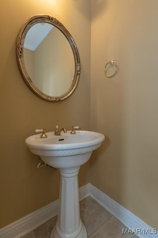 bathroom featuring tile patterned floors and baseboards