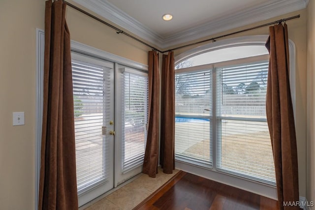 details featuring french doors and crown molding