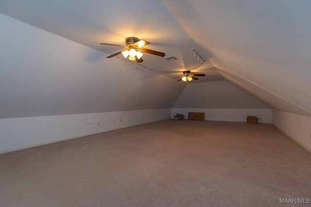 bonus room featuring vaulted ceiling, ceiling fan, visible vents, and light colored carpet