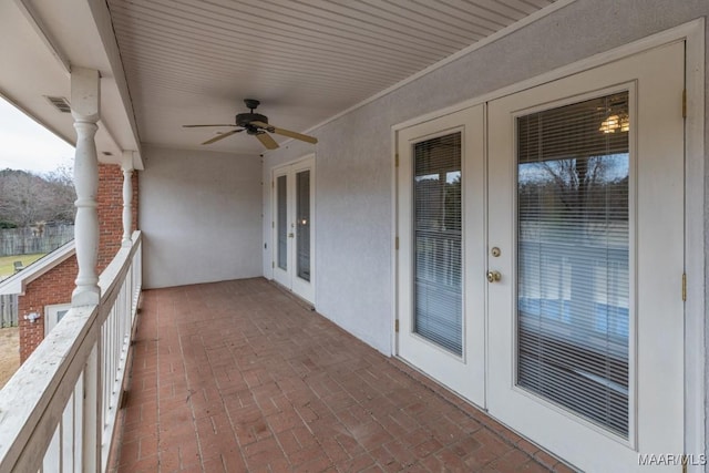 balcony with ceiling fan, french doors, and visible vents