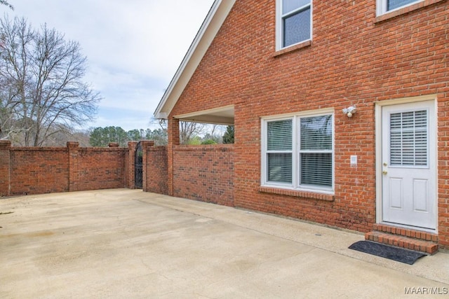 view of patio featuring fence