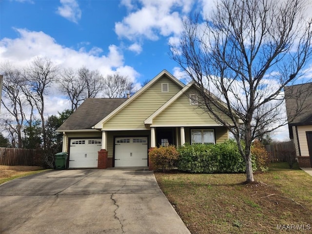 view of front facade featuring an attached garage, fence, concrete driveway, and brick siding